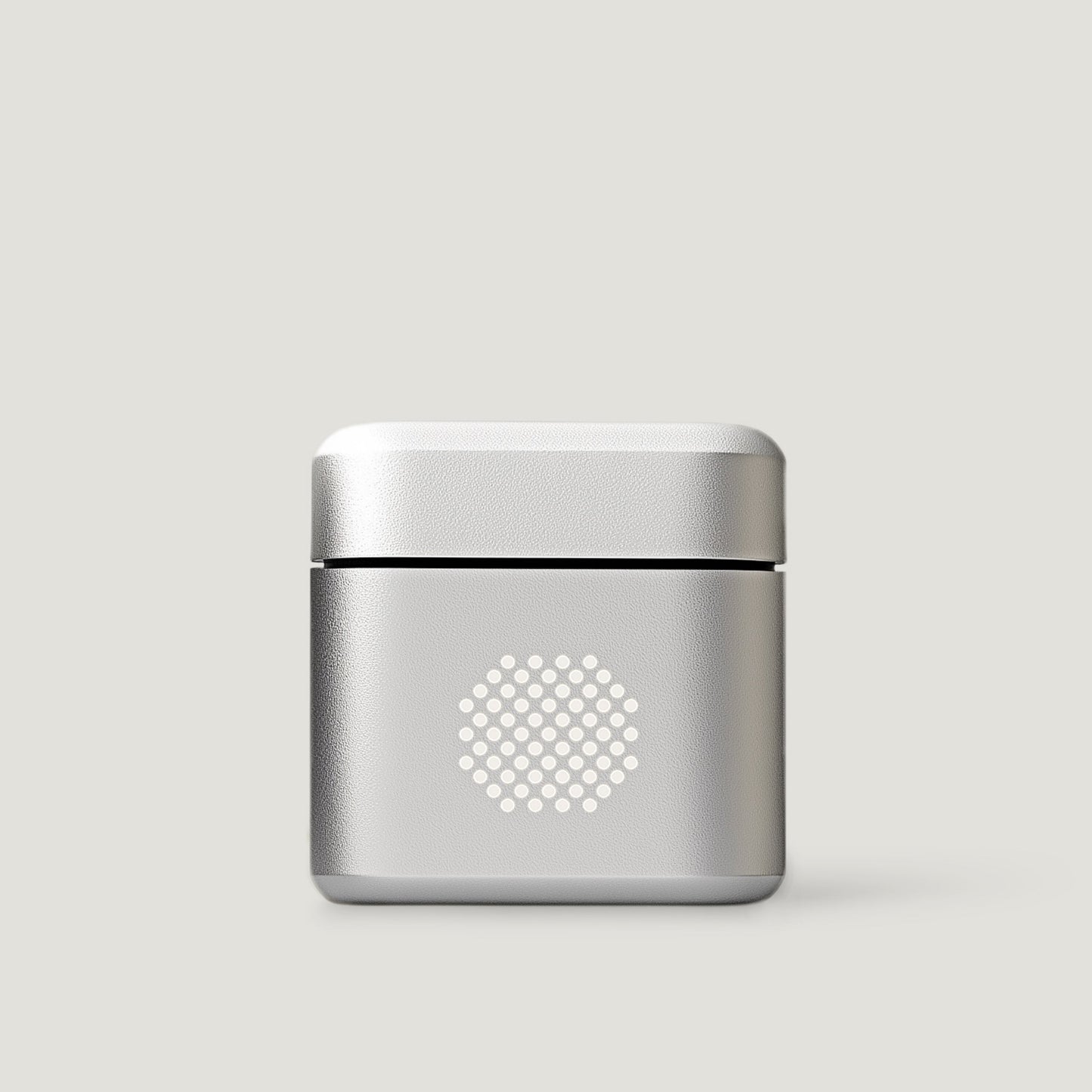 Silver compact audio amplifier on a neutral background