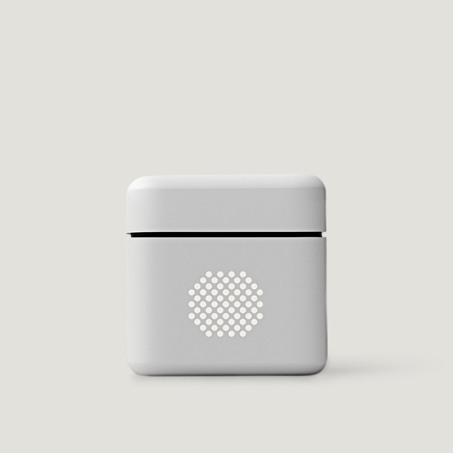 White compact audio amplifier on a neutral background