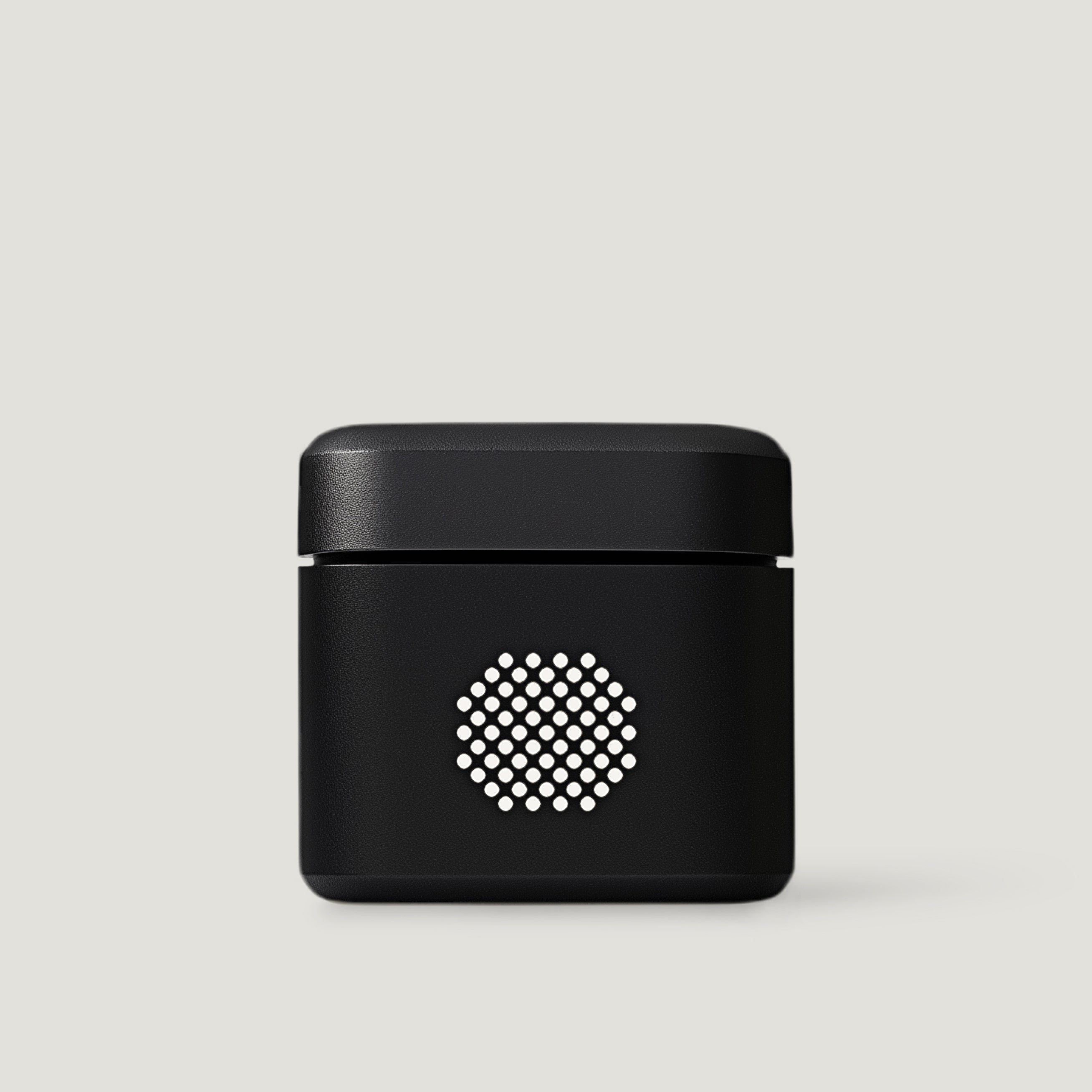 Black compact audio amplifier on a neutral background
