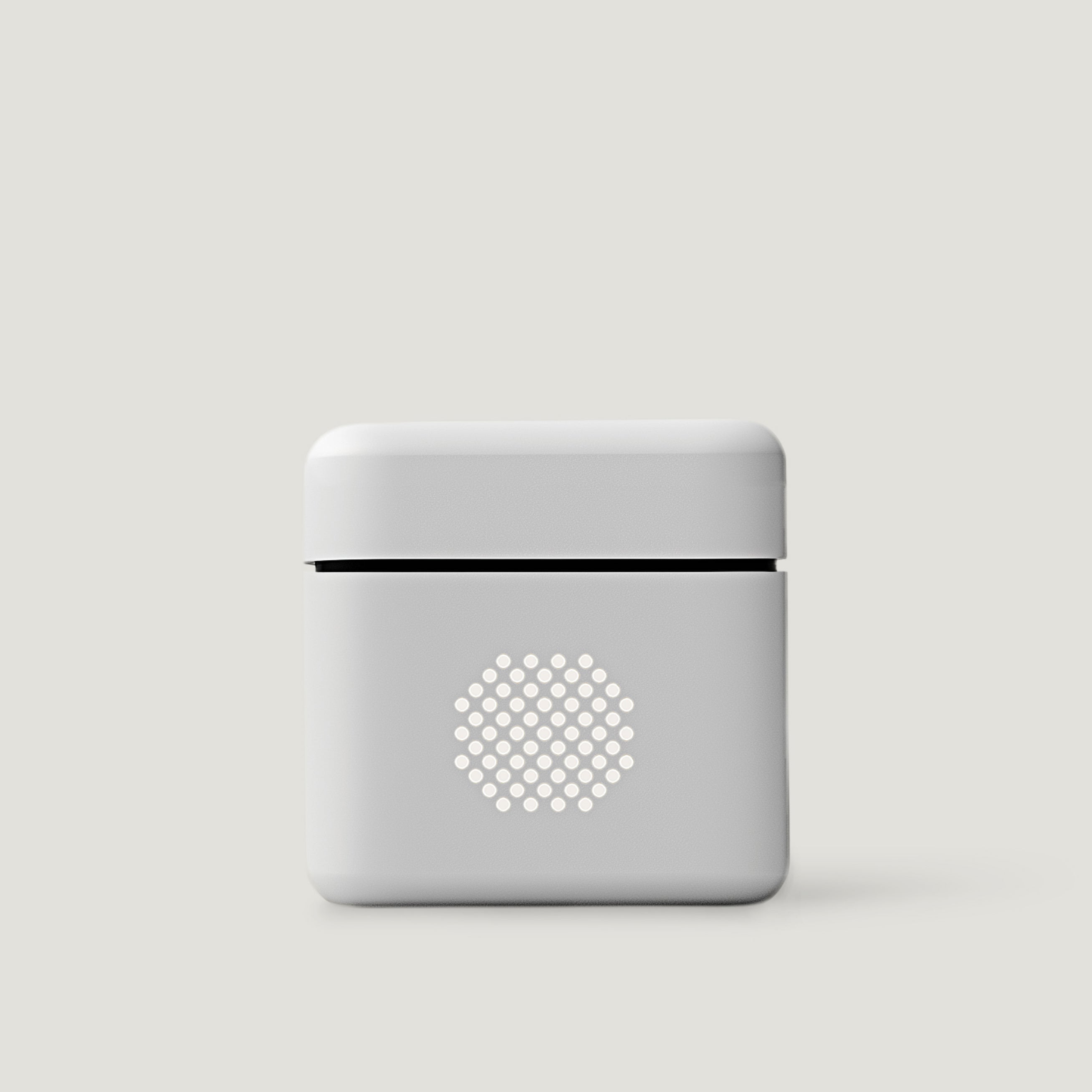 White compact audio amplifier on a neutral background