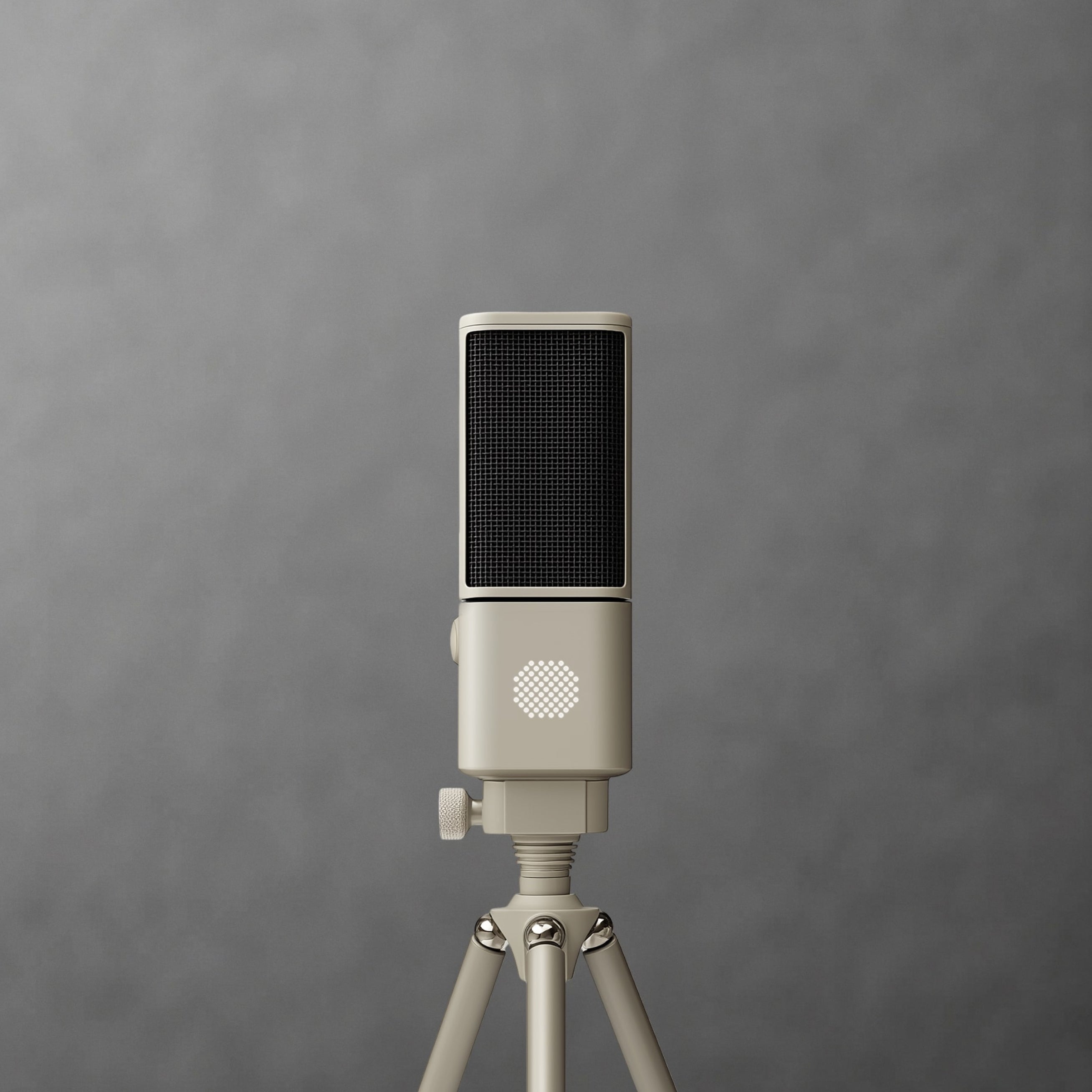 Close-up of a cream SOVA R1 microphone on a tripod against gray