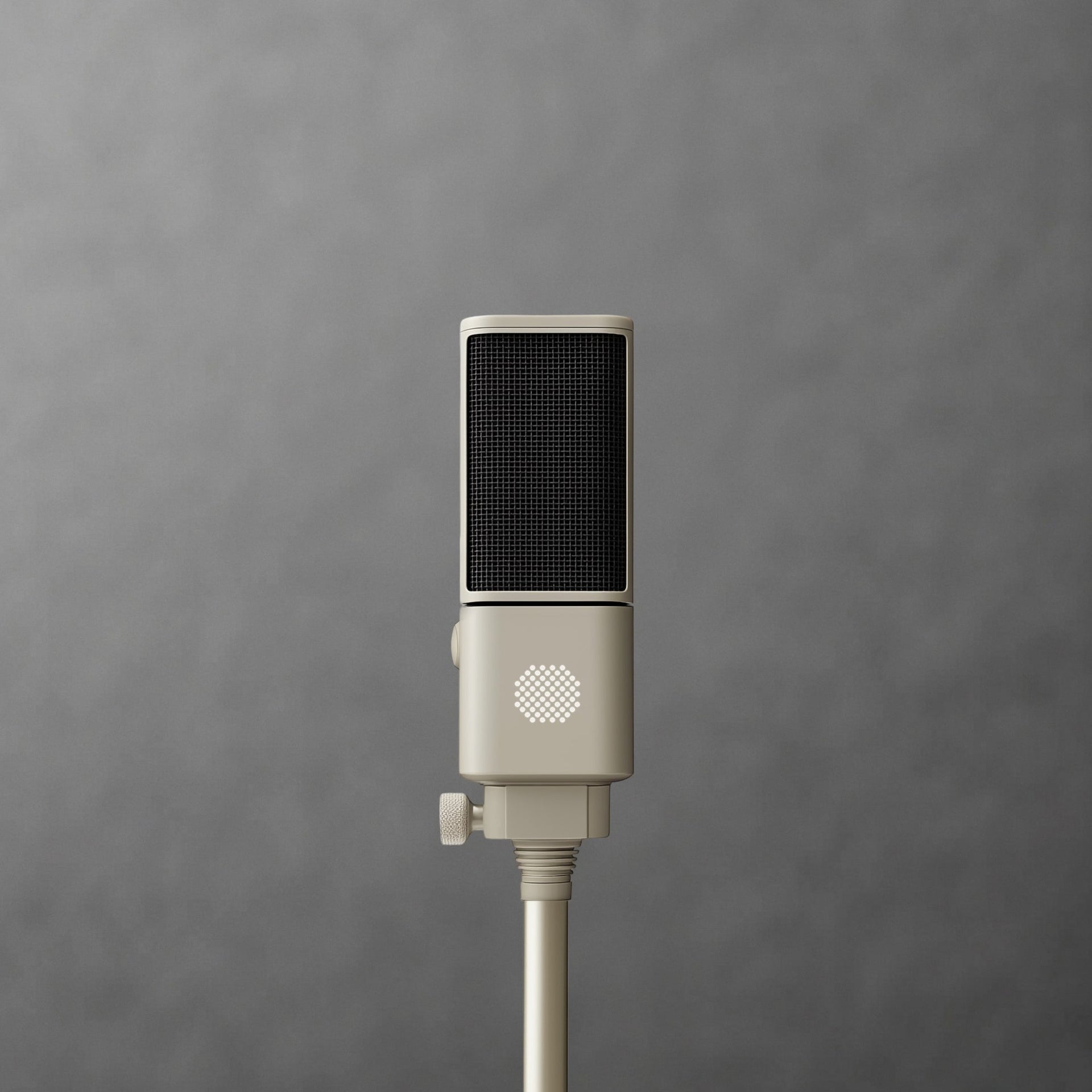 Close-up of a cream SOVA R1 microphone on a stand against gray
