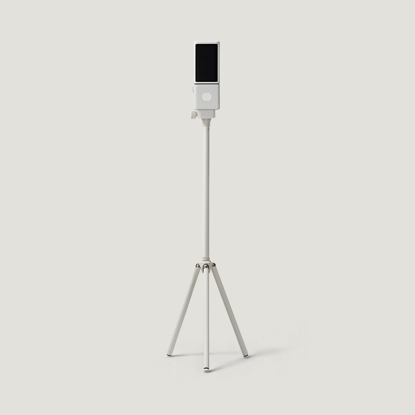 Silver SOVA R1 microphone on a tall floor tripod
