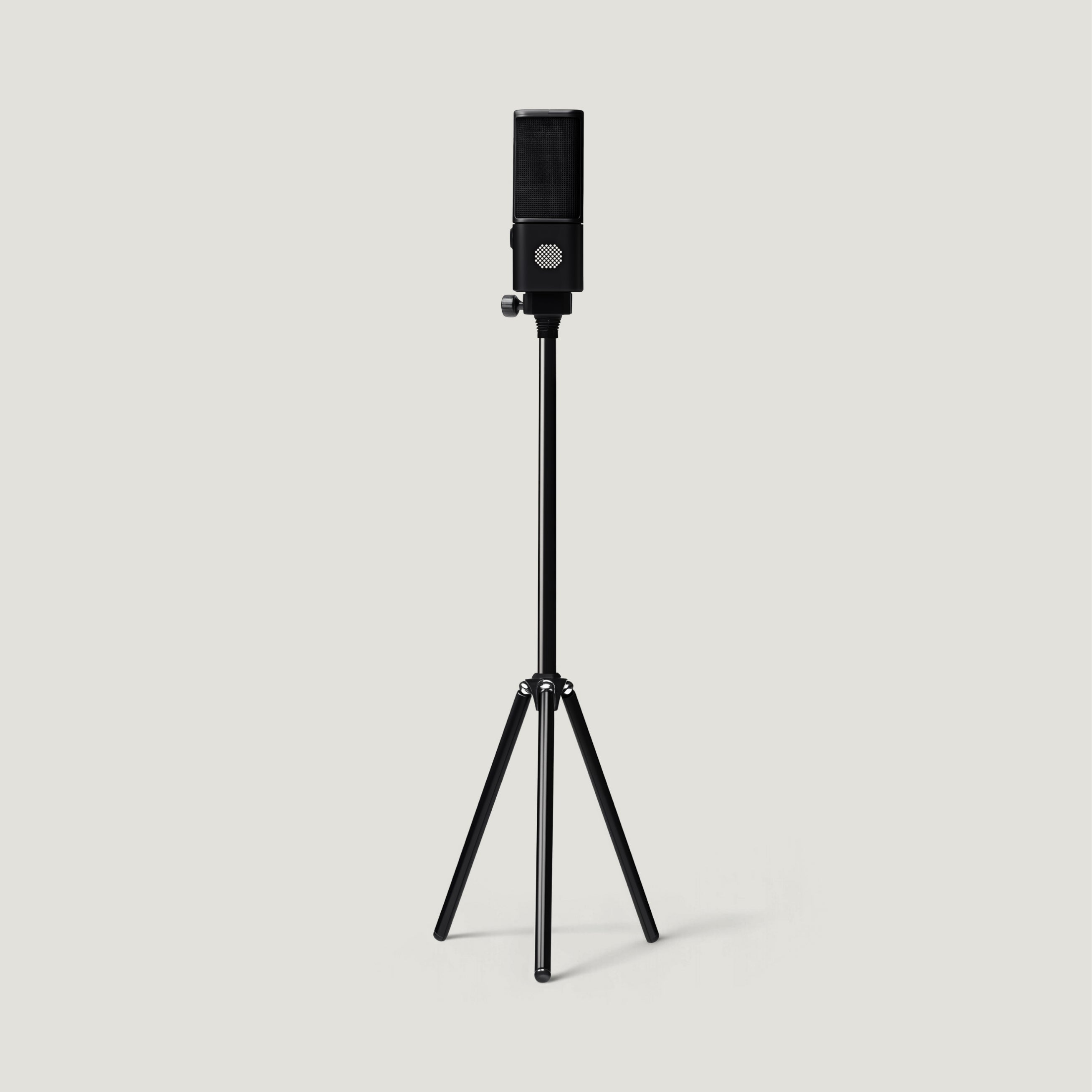 Black SOVA R1 microphone on a tall floor tripod